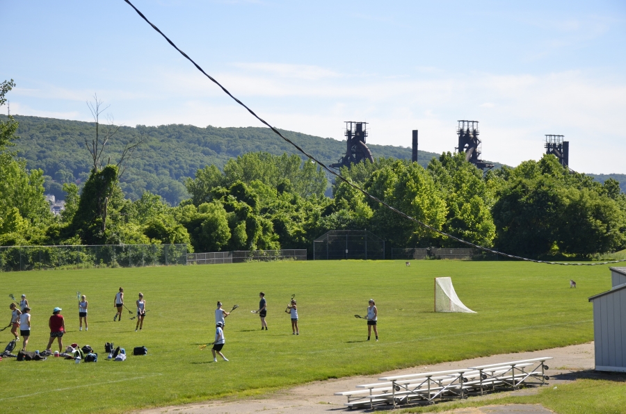 Lacrosse players in the shadow of the old Bethlehem Steel mill.