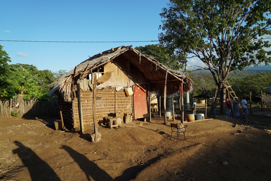 a small home made from mud and cans