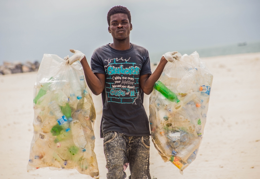A volunteer in Nigeria collects waste on a beach during the Ocean Conservancy’s annual International Coastal Cleanup. Plastic straws were the seventh most common type of trash found last year. A volunteer in Nigeria collects waste on a beach during the Ocean Conservancy’s annual International Coastal Cleanup. Plastic straws were the seventh most common type of trash found last year.