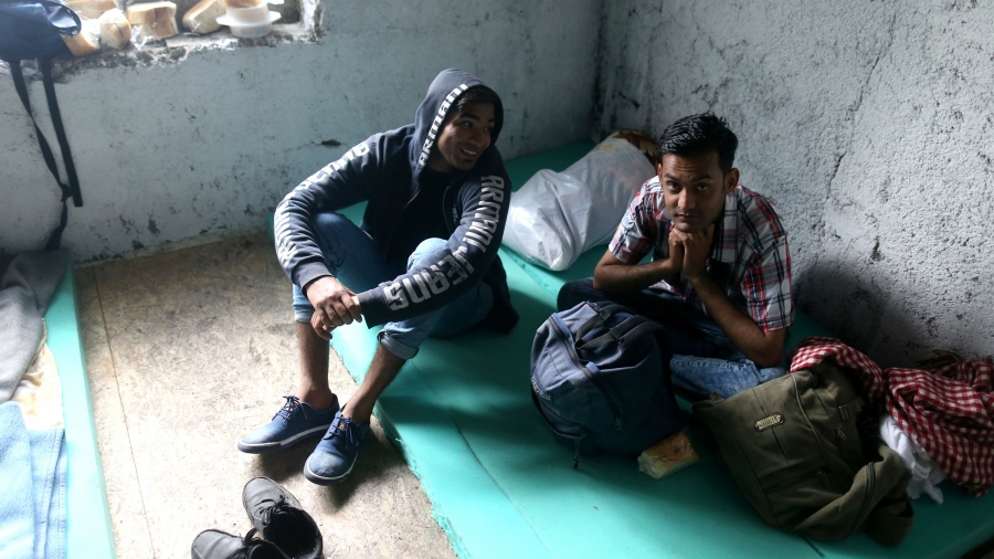 Migrants rest in a dorm destroyed during the Bosnian 1992-1995 war, in Bihac, Bosnia-Herzegovina, May 11, 2018.