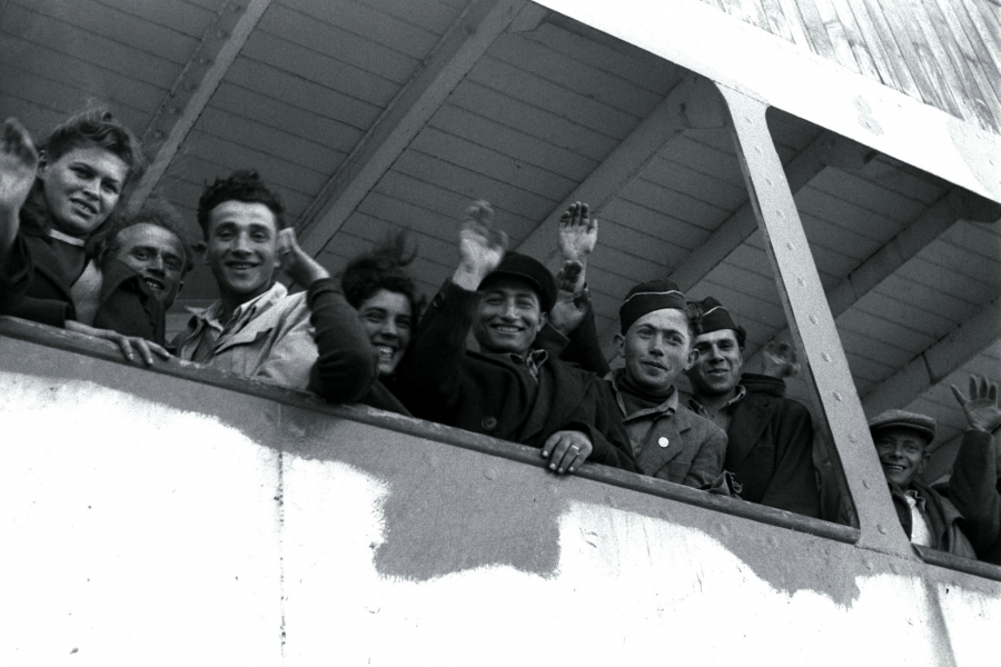 Newly arriving Jewish refugee from the Nazi Holocaust wave from the ship "S.S. Awarea" as it pulls into Haifa port on April 6, 1948. Newly arriving Jewish refugee from the Nazi Holocaust wave from the ship "S.S. Awarea" as it pulls into Haifa port on April 6, 1948.