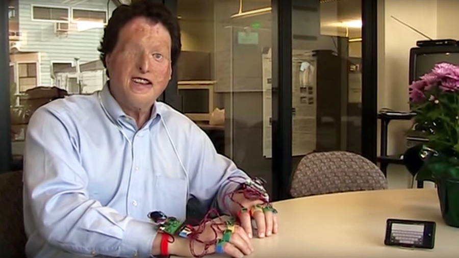 Scientist Joshua Miele demonstrates a virtual wireless Braille keyboard attached as an input device to an Android phone. Scientist Joshua Miele demonstrates a virtual wireless Braille keyboard attached as an input device to an Android phone.