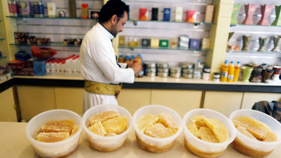 Chunks of honeycomb sit on a counter in a shop.