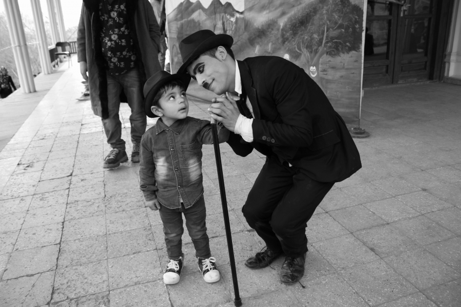 Karim Asir greets an audience member. Karim Asir greets an audience member.