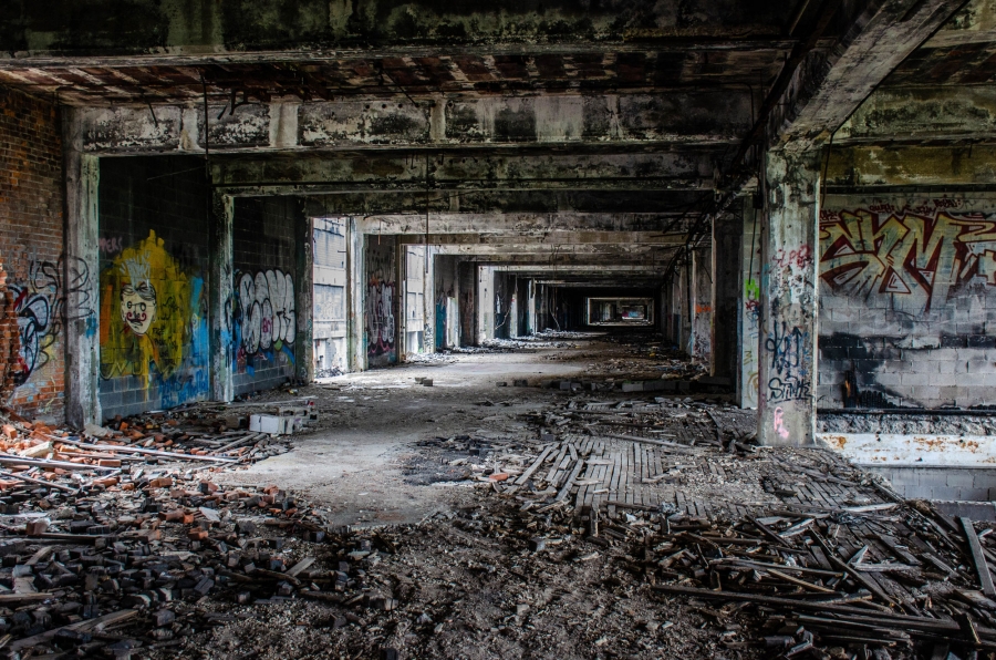 Inside the old Packard Plant. Between WWI and WWII, Packard was considered America’s premier maker of luxury cars. Roughly 40,000 people worked at the facility in Detroit at its peak. A look inside the old Packard Plant showing grafitti, bricks and other debris everywhere and a general bombed-out look.