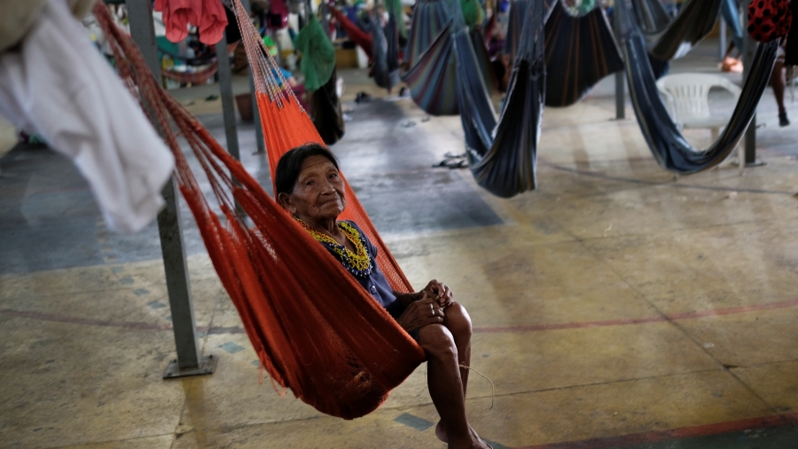 An indigenous Warao woman from the Orinoco Delta in eastern Venezuela is pictured on a hammock at a shelter in Boa Vista, Roraima state, Brazil, Aug. 11, 2018. An indigenous Warao woman from Venezuela swings in a hammock at a shelter in Brazil