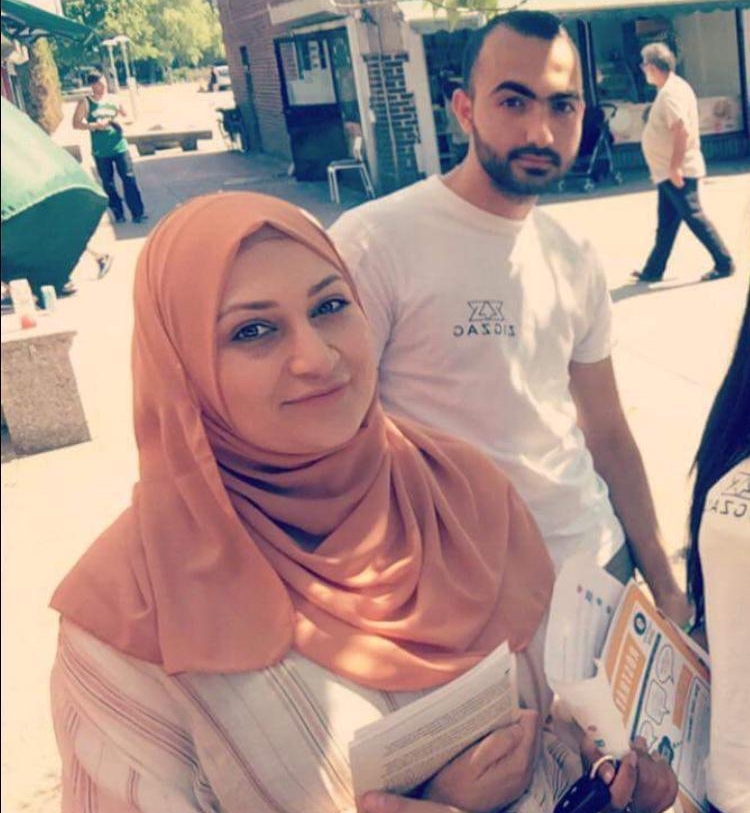Alana Abdalla canvassed with ZigZag, an organization focused on increasing voter turn out, before Sweden's general elections on Sept. 9, 2018. Alana Abdalla wears an orange headscarf and carries election materials