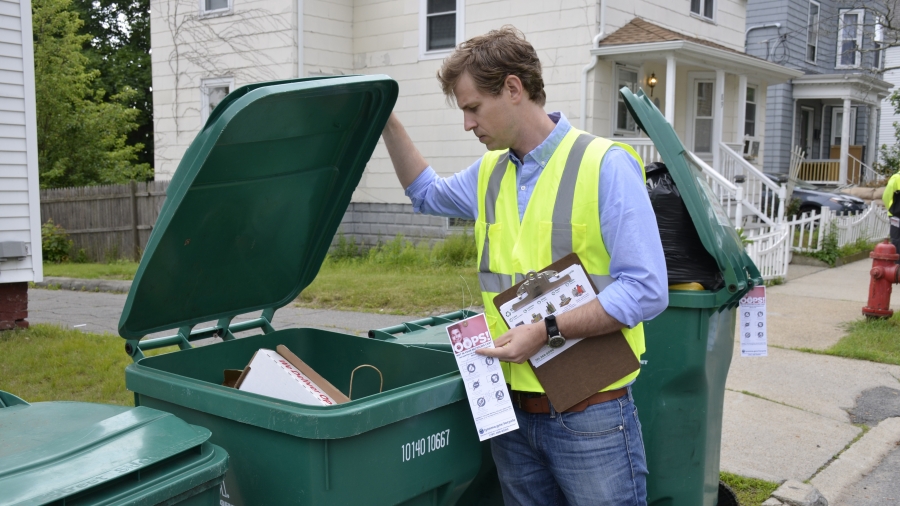Cody Marshall, with The Recycling Partnership, looks through a recycling bin in Lynn, Massachusetts. His organization is working with cities across the nation, helping them educate residents on how to recycle better. Cody Marshall, with The Recycling Partnership, looks through a recycling bin in Lynn, Massachusetts. His organization is working with cities across the nation, helping them educate residents on how to recycle better.