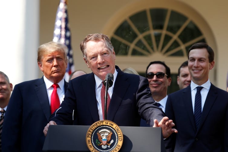 Trump and US Trade Representative Robert Lighthizer standing in front of the white house