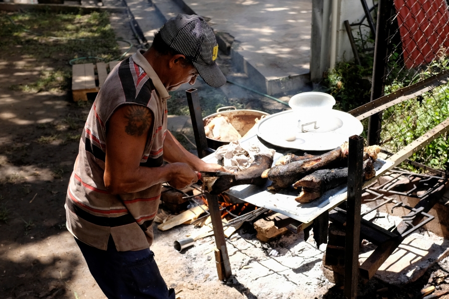 Caracas cattle rancher A man standing over a grill