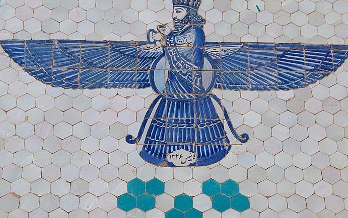 A glazed tile depiction of the Zoroastrian god Ahura Mazda, Taft, Iran. A glazed blue tile depiction of Zoroastrian god Ahura Mazda with blue wings.