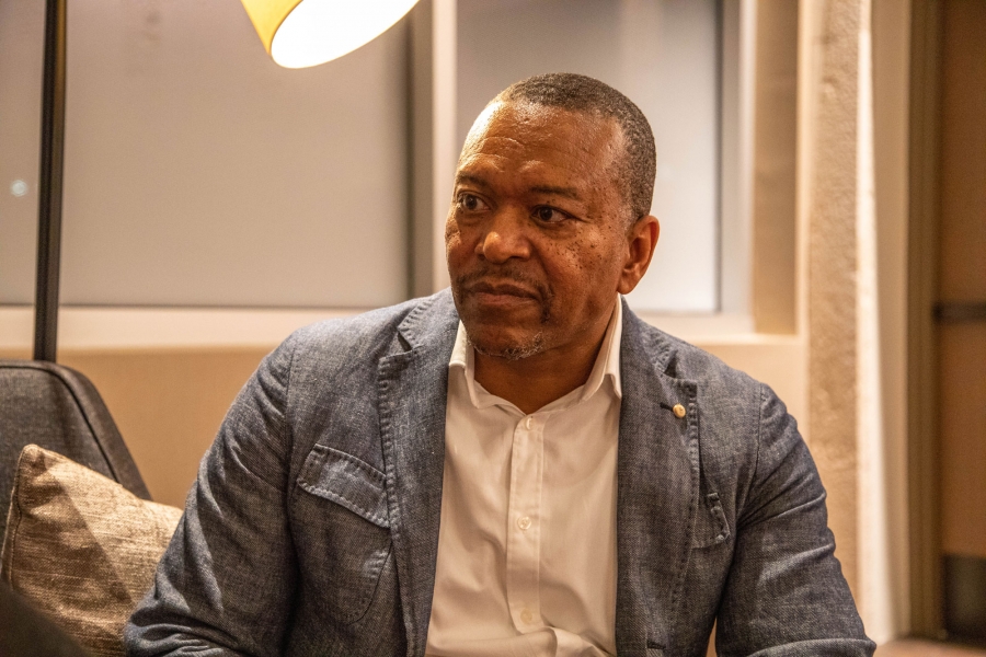 Leo Smith, is the former Georgia GOP minority engagement director. Leo Smith is shown wearing a blazer looking to his right.
