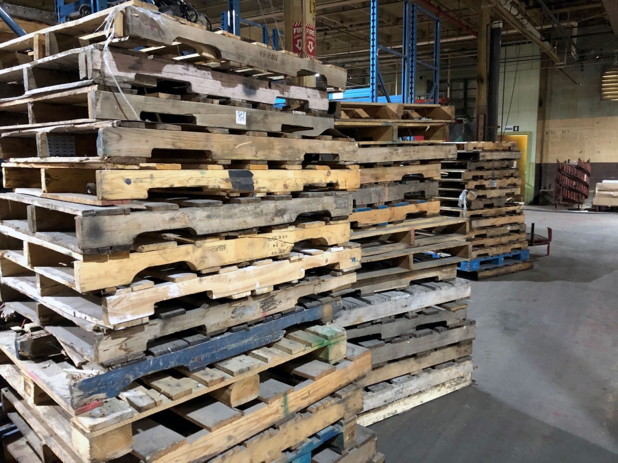 Wooden shipping pallets. Standards established a dozen years ago have helped prevent the outbreak of a major pest infestation in the US, but many are worried that protections are insufficient. Wooden shipping pallets stacked high.