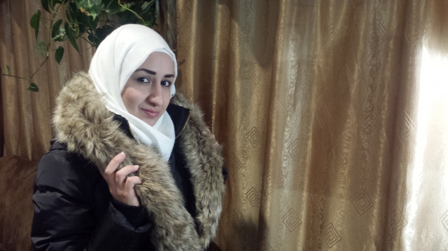 Khuloud Baranbo with her new winter coat, bought at a Black Friday sale. Her family counts their pennies to make ends meet in Canada. Khuloud Baranbo with her new winter coat, bought at a Black Friday sale. Her family counts their pennies to make ends meet in Canada.