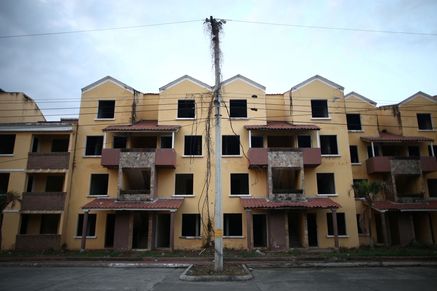 The facade of a building occupied by Barrio-18, so-called Crazy House, is seen in San Pedro Sula, Honduras. The facade of a building without windows or doors, occupied by Barrio-18, is seen in San Pedro Sula, Honduras.