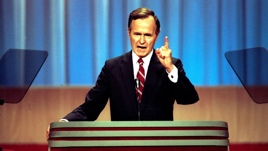 A man stands at a podium