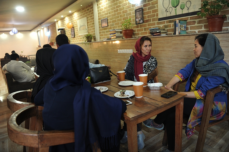 Young men and women enjoy an afternoon at the ICafe in Kabul, Afghanistan. Young men and women enjoy an afternoon at the ICafe in Kabul, Afghanistan.