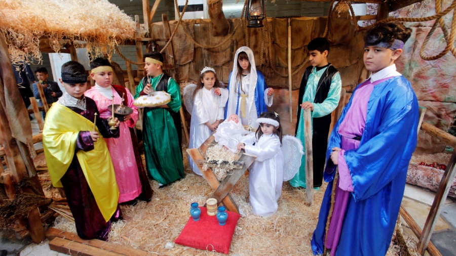 Iraqi children Nativity scene Eight children represent the Nativity scene, dressing as Mary, Joseph, the three Kings, shepherds and angels.