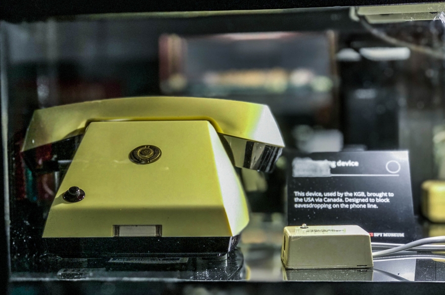 This ominous, dial-free phone was actually an anti-listening device — designed to prevent Soviet agents' phones from being bugged while on assignment. A dial-free phone is shown with a single button and handset.