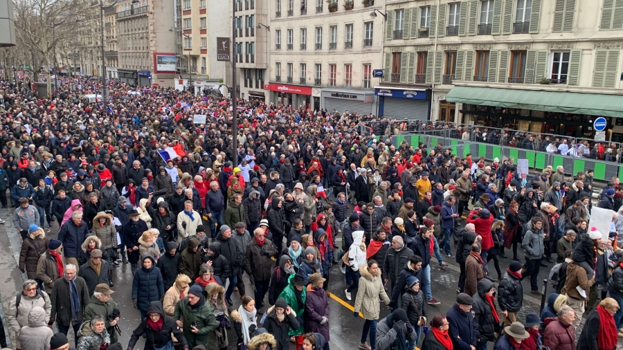 Parisians don red scarves calling for end to yellow vest violence