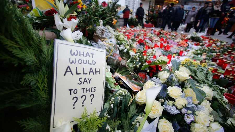 A card reads "what would Allah say to this?" next to bouquets of flowers.