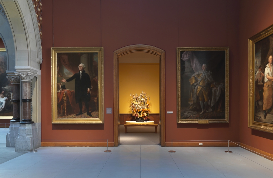 Rina Banerjee’s sculpture, “Her Captivity,” 2011, can be seen through the archway, bookended by two 17th century paintings. Rina Banerjee’s sculpture, “Her Captivity,” 2011, can be seen through the archway, bookended by two 17th century paintings.