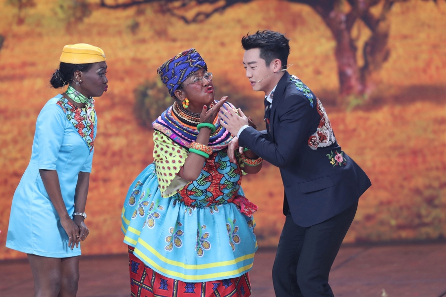Chinese actor Lou Naiming (C) performs a skit wearing blackface at a Lunar New Year gala in Beijing, China, Feb. 15, 2018. Chinese actor Lou Naiming is shown performs a skit wearing blackface and a colorful dress.