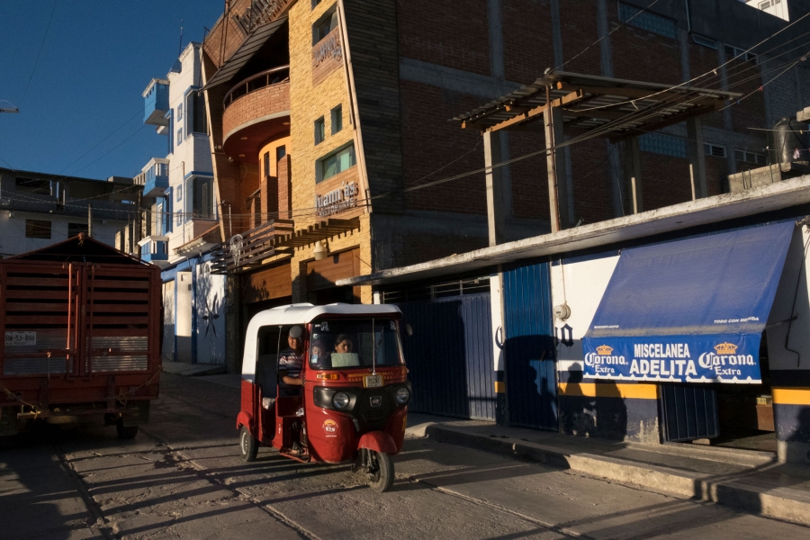 A motorcycle taxi passes by Juann’as Ristorante pizzeria in Tlaxiaco. The restaurant opened three years ago after the owners returned to Mexico after years of working in New Jersey. A three-wheel motorcycle taxi is shown driving by Juann’as Ristorante pizzeria in Tlaxiaco.