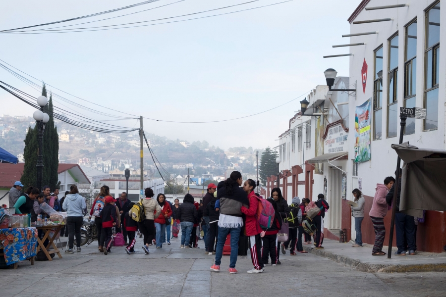 Outside of Tlaxiaco’s elementary school during morning drop-off. A group of people are shown outside of Tlaxiaco’s elementary school during morning drop-off.