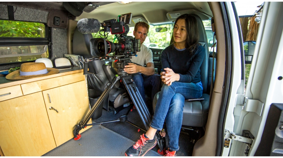 Chai Vasarhelyi Chai Vasarhelyi seats inside a van with a cameraman and his camera.