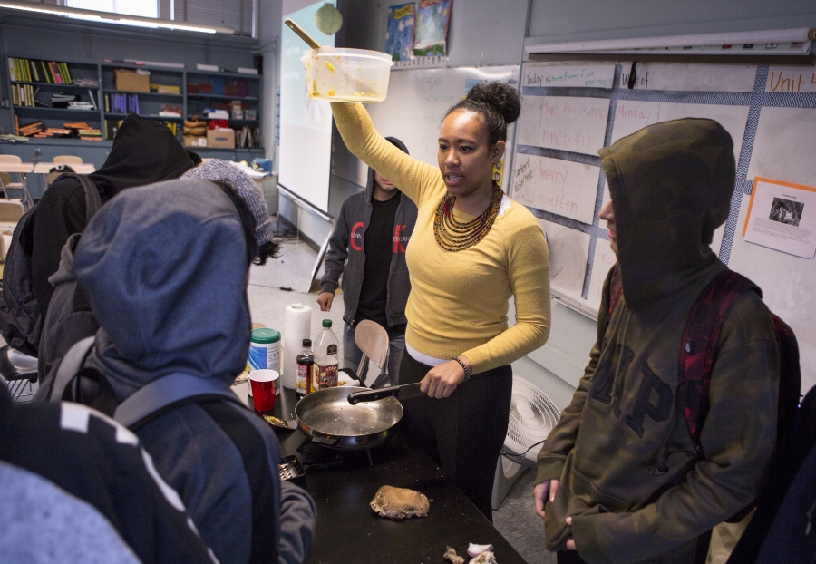 A teacher is cooking.