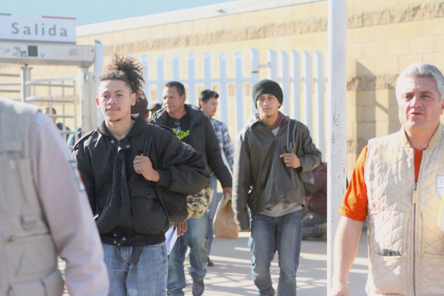 Central American migrants returned to the US from Mexico at the border crossing Central American migrants returned to the US from Mexico at the border crossing
