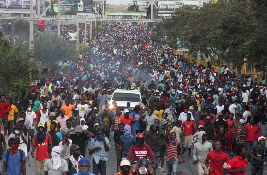 People fill a street as far back as the eye can see