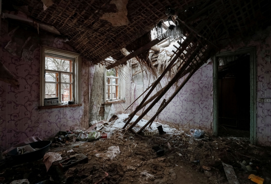 A house damaged by shelling in the village of Zaitseve. A house in the village of Zaitseve is shown with the roof caved in after a shelling.
