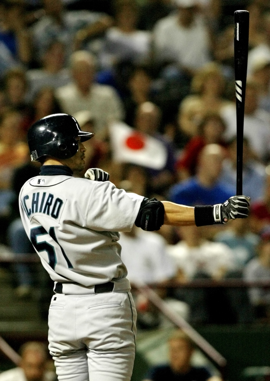 Seattle Mariners outfielder Ichiro sets up in the batter's box as a fan waves a Japanese flag in the background at a game against the Texas Rangers in Arlington, Texas, September 24, 2004. Ichiro would break the record for most hits in a single season tha Seattle Mariners outfielder Ichiro sets up in the batter's box as a fan waves a Japanese flag in the background at a game against the Texas Rangers in Arlington, Texas, September 24, 2004. Ichiro would break the record for most hits in a single season tha