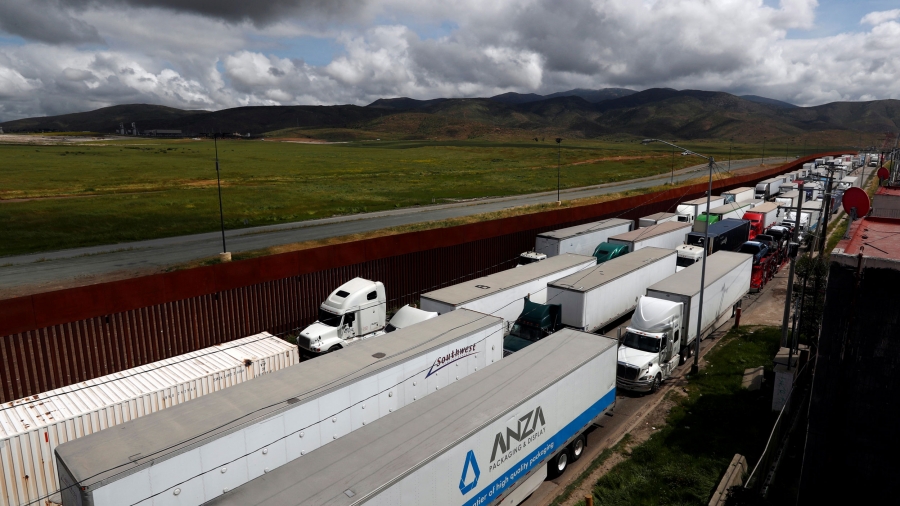 Trucks are backed up unmoving on a highway