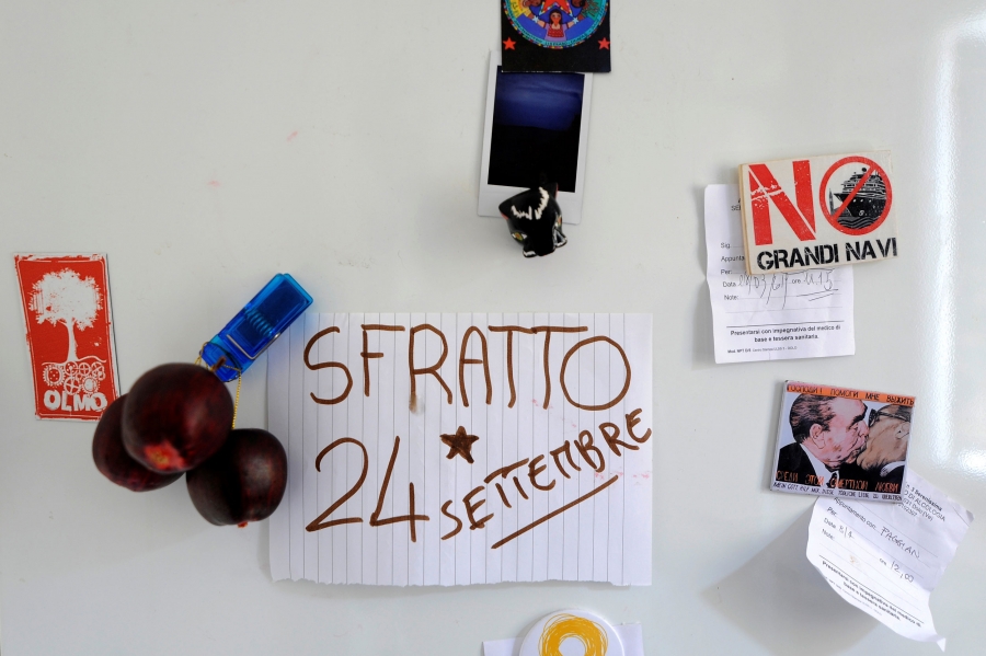 A note with the date of the next scheduled eviction is seen on the fridge of Alessandro Dus' illegally occupied apartment. "24th of September is the date they will come to try to evict me from the apartment. I need to be home when they arrive," Dus said. A note on line paper is seen on a white refrigerator with "Sfratto 24 Settembre" written on it.