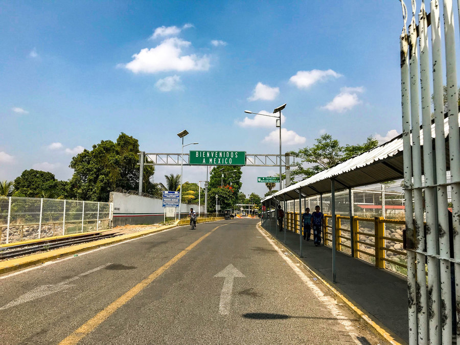 An official entry point from Guatemala into the municipality of Suchiate in the Mexican state of Chiapas. An official entry point from Guatemala into Mexico with a large green sign that reads, "Bienvenidos a Mexico."