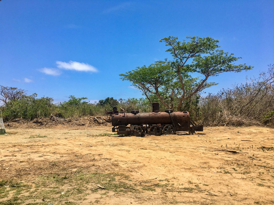 A rusty train left over from Vieques’ former sugar mill, which closed after the military occupied two-thirds of the island in 1942. A rusty train is shown abandoned on a blonde sandy beach.