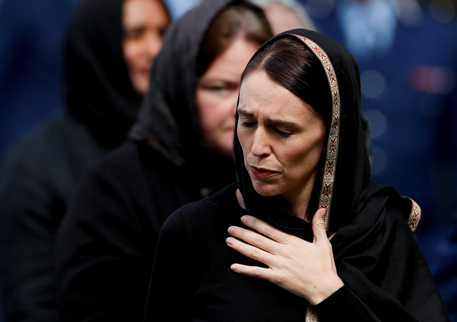 A woman in a dark headscarf