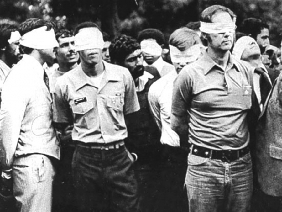 Blindfolded US hostages and their Iranian captors outside the US Embassy in Tehran, Iran, 1979. Blindfolded US hostages and their Iranian captors outside the US Embassy in Tehran, Iran, 1979.