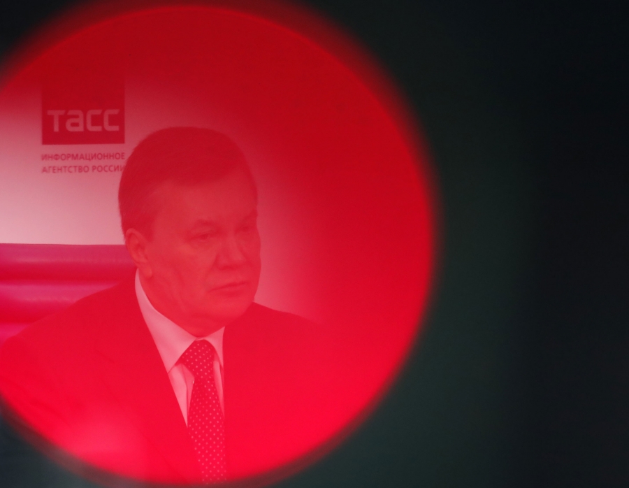 Yanukovych A man seen through a red circle of light