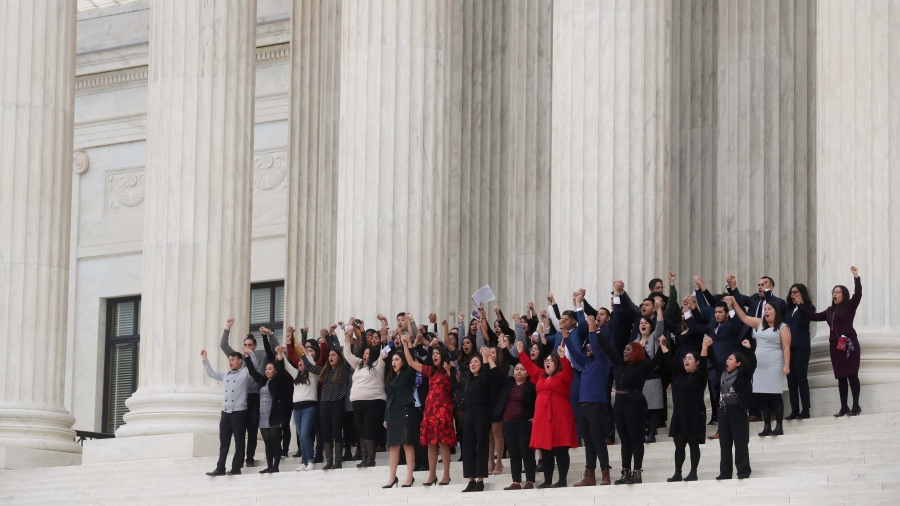 DACA plaintiffs walk arm-in-arm down from the US Supreme Court after justices heard oral arguments in the consolidation of three cases before the court regarding the Trump administration’s bid to end the DACA program on Nov. 12, 2019. DACA plaintiffs walk arm-in-arm down from the US Supreme Court after justices heard oral arguments in the consolidation of three cases before the court regarding the Trump administration’s bid to end the DACA program on Nov. 12, 2019.