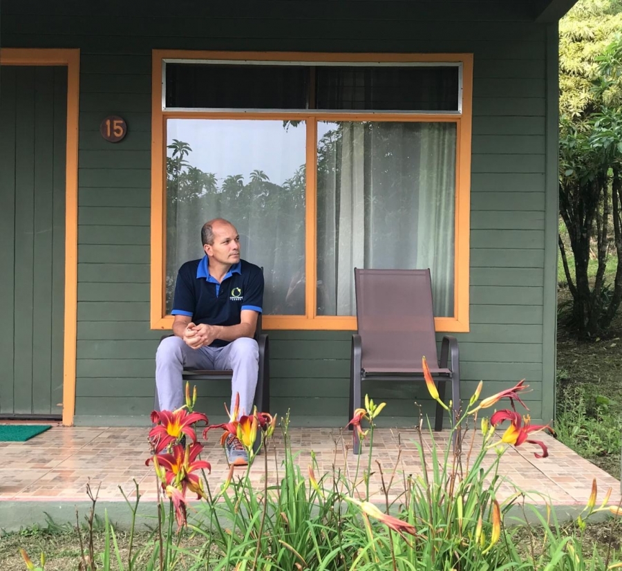 A man sits on a porch