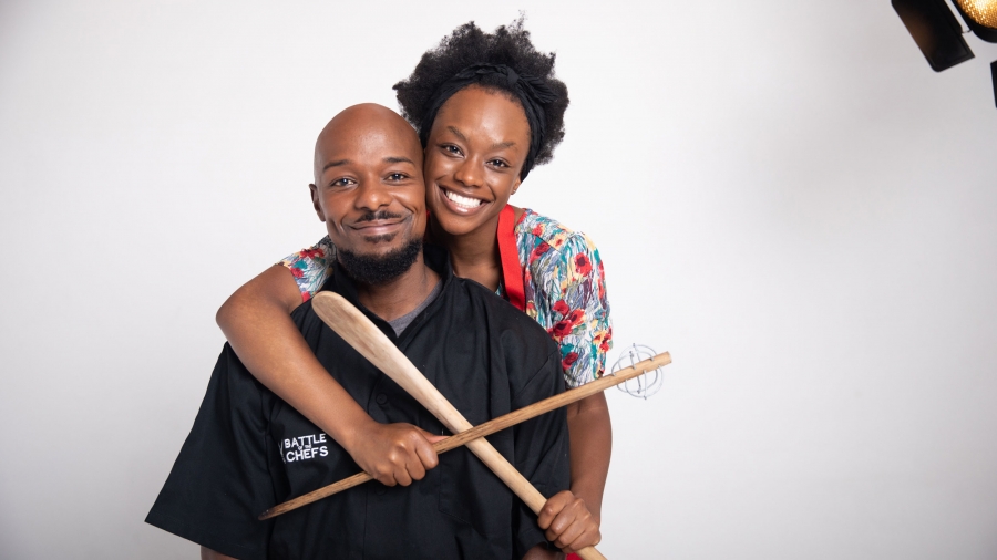 Tendai Ryan Nguni and Tendaiishe Chitima star as Prince and Anesu in the Zimbabwean film "Cook Off." A black man and a black woman pose in a hug for a publicity photo of the film "Cook Off"
