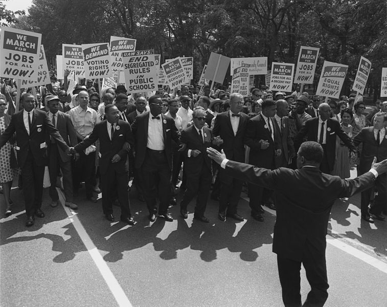 Leaders at the head of the Civil Rights March on Washington, DC, August 28, 1963. Civil rights and union leaders include: Martin Luther King, Jr., Joseph L. Rauh Jr., Whitney Young, Roy Wilkins, A. Philip Randolph, Walter Reuther, and Sam Weinblatt. Leaders at the head of the Civil Rights March on Washington, DC, wearing suits and carrying signs.