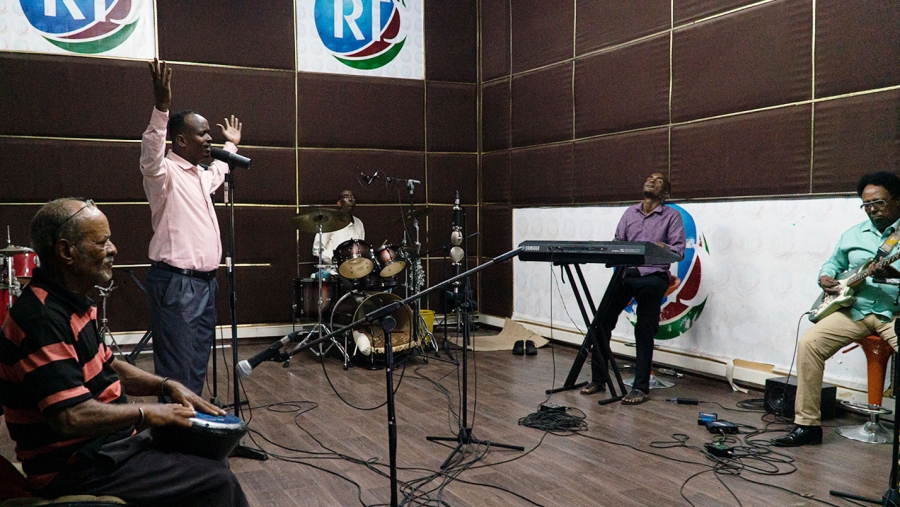 Musicians recording in a studio