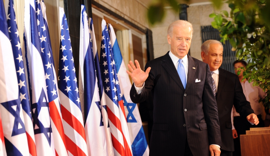 VP Joe Biden with Israeli PM Benjamin Netanyahu on a stage with US and Israeli flags VP Joe Biden with Israeli PM Benjamin Netanyahu on a stage with US and Israeli flags