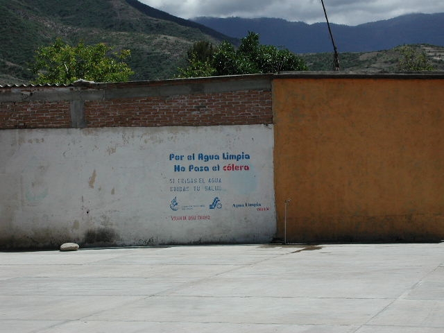 An anti-cholera campaign for clean drinking water in Oaxaca A stenciled message displayed on a concrete wall