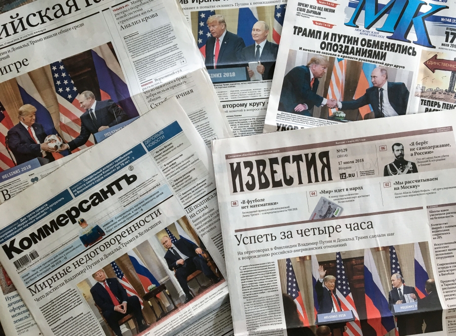 Russian outlets have been largely supportive of President Trump, but have been critical of his handling of the coronavirus. A stack of front pages from Russian newspapers depicting photos of Trump and Putin's friendly relationship.